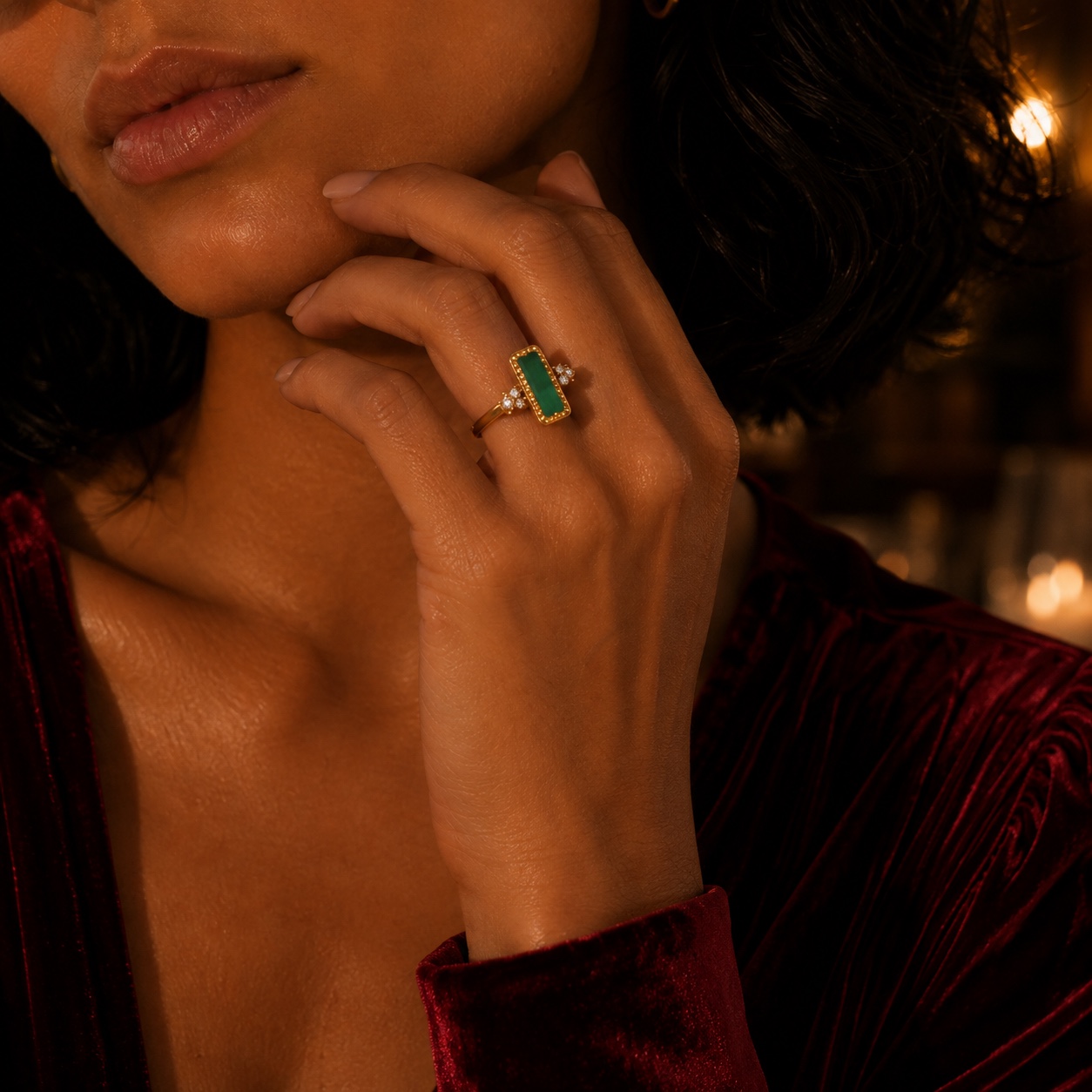 Close editorial portrait of Bobbie wearing the Émeraude rectangular green gemstone ring